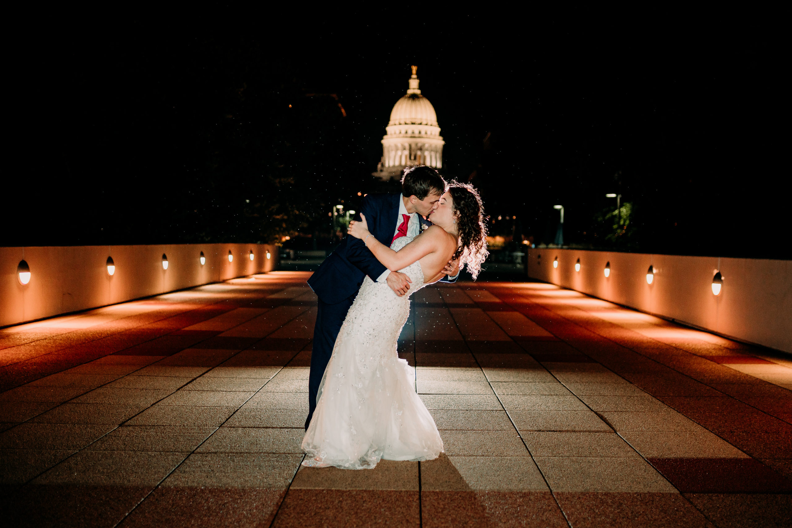 Bride and groom night portrait in front of Capitol Madison, WI