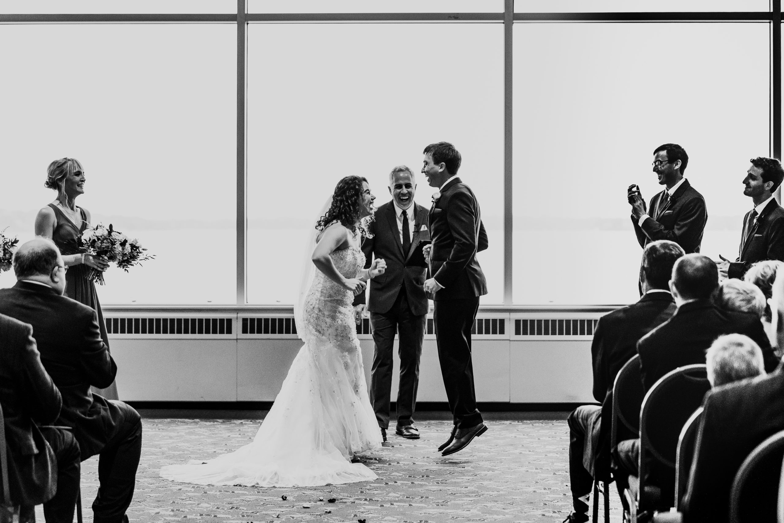 Excited wedding couple during ceremony at Monona Terrace.
