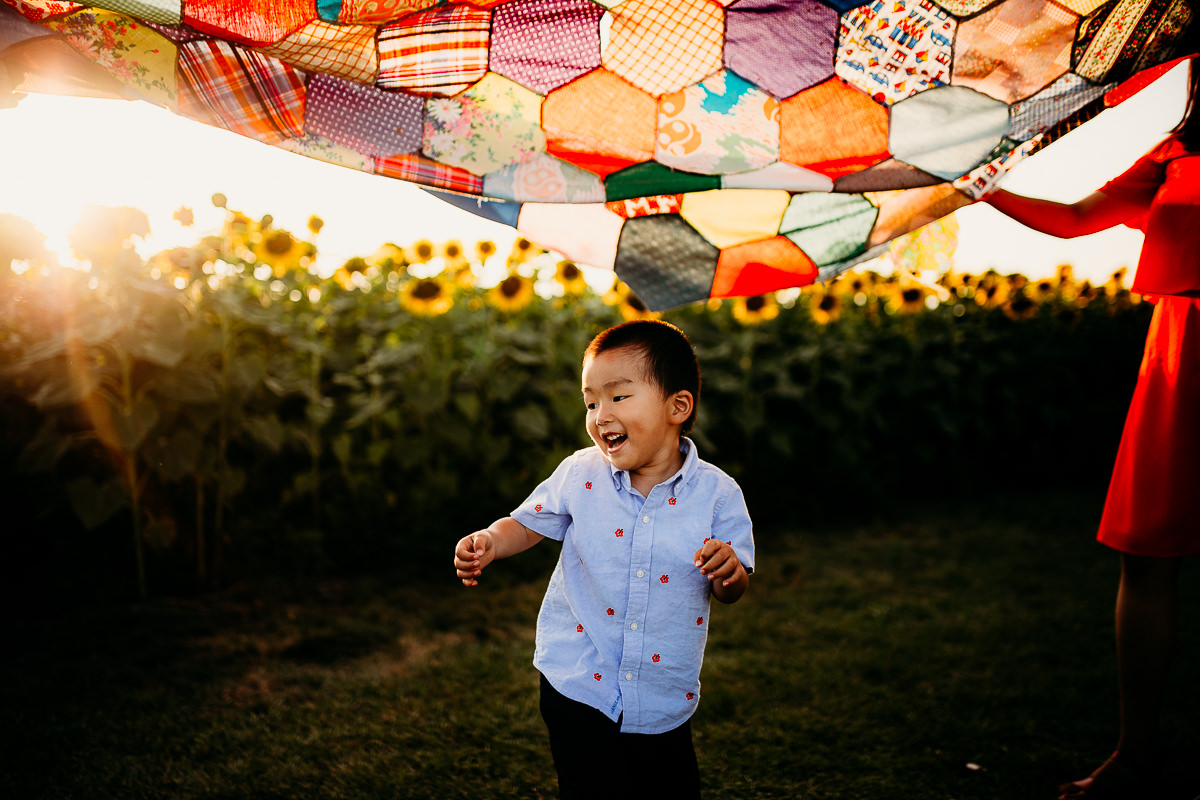 Bold and colorful sunflower session of boy dancing